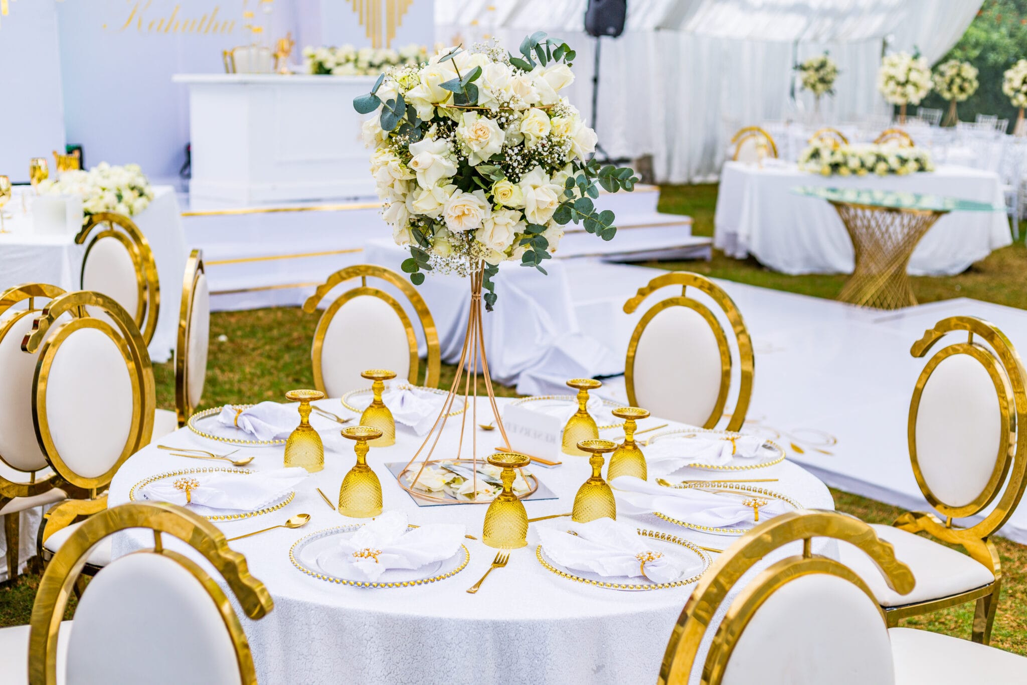 Elegant floral wedding table setting with gold details