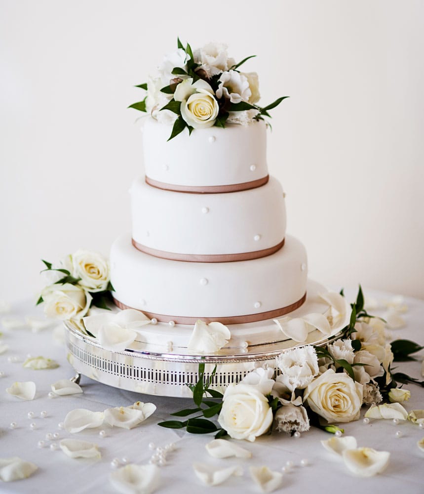 Tiered wedding cake decorated with flowers